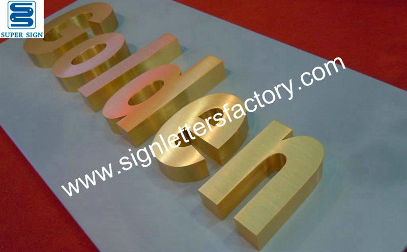 golden brushed stainless steel sign letters